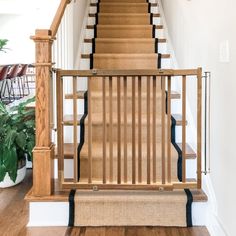 the stairs are made of wood and have black trim