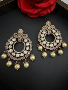 This a beautiful Premium gold Long Chandbali earring Premium Moissanite Kundan and Cubic Zirconia detailed work with All natural Stones is very light weighted. It is a statement earring with stunning designer look which makes it a must to have in your collection. This is so beautiful to look at and a perfect one for Indian weddings.  Color : Pink length : 2.75 inch width : 2 inch Each earring Weight : 18.7 grams Material : Brass , Natural Stones, Cubic Zirconia, Moissanite Kundan Beautiful High Luxury Chandbali Jeweled Danglers, Luxury Stone Work Chandbalis For Wedding, Luxury Chinon Chandbali Saree, Bollywood Style Jeweled Bridal Earrings For Reception, Jeweled Chandbalis For Reception And Festivals, Diwali Reception Chandelier Earrings With Stone Work, Chandbali Jeweled Bridal Earrings For Reception, Jeweled Chandbali Earrings For Wedding, Jeweled Chandbali Bridal Earrings For Reception