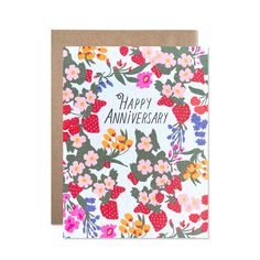 an anniversary card with flowers and strawberries on the front, reads happy anniverary