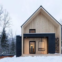 a house in the middle of winter with snow on the ground