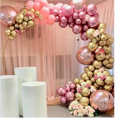 balloons and flowers are on display at a party