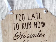 a wooden sign that says, too late to run now harder than i can't