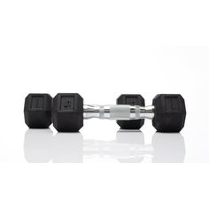 three black rubber dumbbells are shown on a white surface with reflection in the foreground