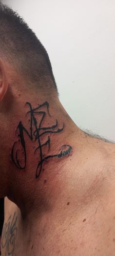 a man with a tattoo on his neck