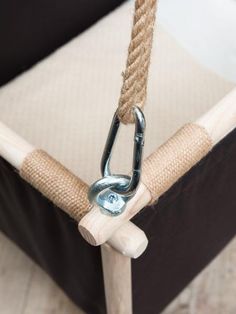 a close up of a chair with a rope on it