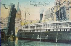 an old postcard shows the steamboat passing through grand ave, nashville, wv