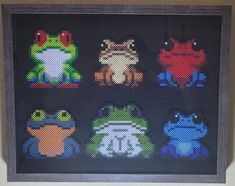 the cross stitch pattern has been framed in a dark wood frame and is decorated with different colored animals