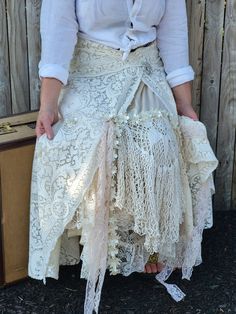 Here we have different textures of vintage lace recycled to make this one of a kind flowing long lace skirt. Skirt has a lot of movement. Underneath the skirt has a slip for lining,This skirt is a medium weight. The color is a vintage cream,with slight variations to the lace. Bottom edge is raw. I can roll the hem if you dont like raw edges. The cool thing about this skirt is you can move it around and wear it backwards,or the to the side,so it has many looks. Vintage brooch is removable at waist comes with skirt. Peachy accents,and flowers adorn this skirt. Great with boots or bare foot Measurement  18-22 inch waist laying flat 22 across hips The size is a ladies 12-16 Large  Depending on measurements.  Waist will stretch to 44 inches so if your hips are larger then 44 the skirt would be Lace Wedding Skirt, Long Lace Skirt, Altered Clothing, Wedding Skirt, Move It, Skirt Skirt, Different Textures, Vintage Brooch, Bohemian Wedding