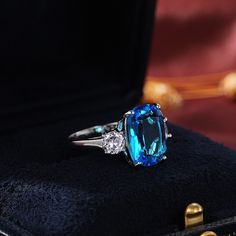 This Luxury Blue Radiant Cut Cubic Zircon Cocktail Ring is classified as Statement Jewelry or as Party Accessories, which will add a touch of pulchritude. The Cocktail Ring looks very modern, suitable for the occasion of a Girl's Night Out. SkyBlue Color is an exquisite choice that stands out from the crowd. You can wear this Luxury Blue Radiant Cut Cubic Zircon Cocktail Ring on its own or partner with classic silhouettes which will add a touch of pulchritude pairing. TJ(trendyjewelrys.com) is y Cubic Zirconia Wedding Rings, Jewelry Details, Blue Stone Ring, Jewelry Luxury, Detailed Ring, Cubic Zirconia Rings, Aquamarine Rings, Rings For Girls, Engagement Bands