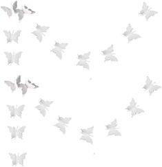 a flock of white butterflies flying in the air