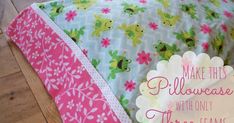 a bed with pink and green flowers on it, next to a pillow that says make this pillowcase with only three seams