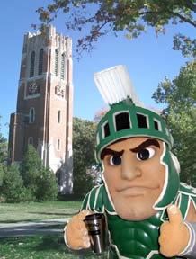 an inflatable statue of a man wearing a helmet and holding a coffee cup