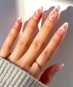 White French tips and candy canes nail arts on long almond nails Christmas Nails Light Pink, Christmas Lights Nail Art, Christmas Light Nails, Season Nails, New Years Eve Nails, Wedding Nails Glitter, Christmas Nails Easy, Cute Christmas Nails, Christmas Gel Nails