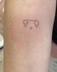 a person with a small tattoo on their arm