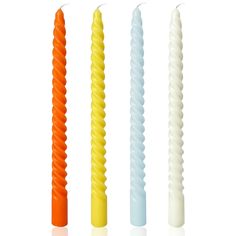 four different colored candles are lined up in a row