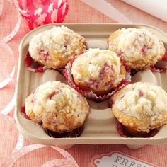 some muffins are sitting in a tray on a table