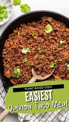 a skillet filled with taco meat and garnished with cilantro