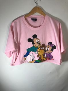 Vintage Mickey and Friends Pink Short Sleeve 90s Style Tops, Pink Cartoon Print Crew Neck Top, 90s Crew Neck Top With Character Print, Pink Crew Neck Top With Cartoon Print, 90s Crew Neck Top With Front Print, 90s Style Crew Neck Top With Front Print, Pink Character Print Summer Top, Pink Character Print Tops For Summer, Pink Cartoon Print Top With Relaxed Fit