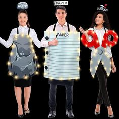 three people dressed up as paper characters with lights on their heads and holding letters that spell out paper