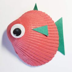 a paper plate shaped like a fish with eyes