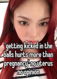 a girl with long red hair is looking at the camera and says getting kicked in the balls hurts more than pregnant