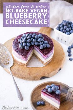 a cheesecake topped with blueberries on a cutting board