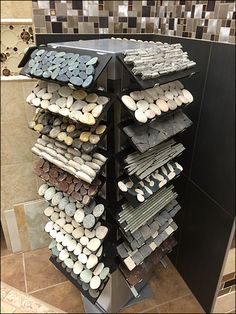 a display case filled with lots of different types of rocks and stones on top of each other