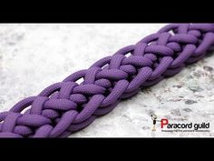 an image of a purple braided bracelet on a stone surface with the words paracord