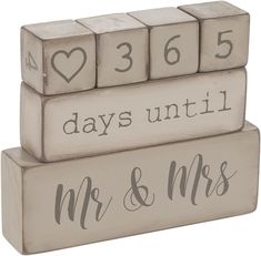 three wooden blocks with the words, days until and mrs and mr on each block