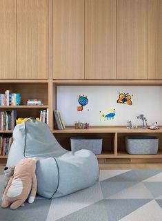 a child's room with bookshelves and toys