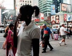 a woman talking on her cell phone while walking down the street