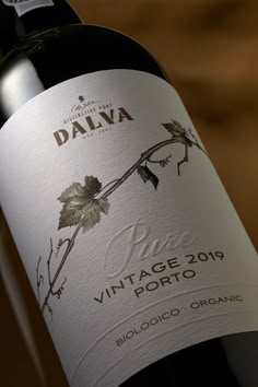 a bottle of dalva wine sitting on top of a table