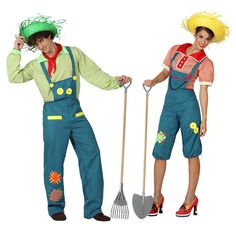 a group of people dressed in costumes with hats and holding shovels, standing next to each other