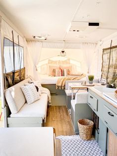 the inside of a camper with lots of furniture