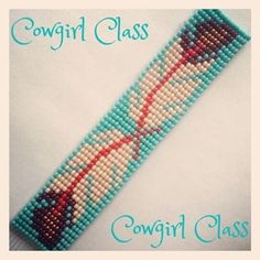 a bracelet made out of beads with the words cowgirl class written in red on it