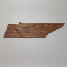 a piece of wood that looks like the state of tennessee is cut into smaller pieces