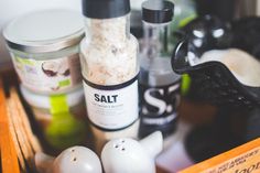 an assortment of salt and pepper shakers sitting on a table next to each other