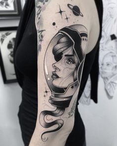 a woman with a space helmet on her arm