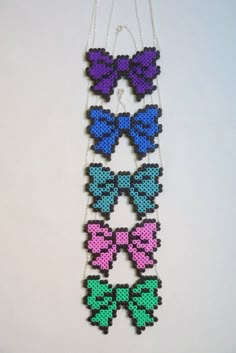 the necklaces are made out of beads and have different bows on each strander