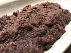 a close up of a brownie in a white bowl