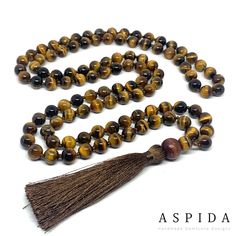 "Real Tigers Eye Gemstone Mala Healing Necklace, Hand Knotted 108 Mala Beads, 108 Mala Beads, Mala Tassel Necklace, Japa Mala, Meditation Mala Aspida Gem Jewelry serve to top jewelry gifts for men and women. If you need unique gifts for girlfriend or boyfriend at anniversary or birthday, we present to you exclusive unique gifts ideas. This Exclusive Unique Hand Knotted 108 Mala Gemstone Design is made details; * Gemstone: 5A Quality Rated Tiger Eyes Gemstone * Rope: Special Extra Durable Mala Ro Brown Mala With Natural Stones And Round Beads, Brown Mala With Natural Stones, Brown Mala With Natural Round Beads, Adjustable Brown Gemstone Beads Mala, Adjustable Brown Mala With Gemstone Beads, Adjustable Brown Gemstone Mala, Brown Natural Stones Mala As A Gift, Spiritual Brown Gemstone Beads, Spiritual Brown Beads For Jewelry Making