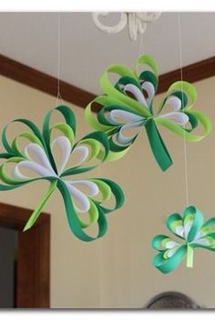 green and white paper shamrocks hanging from strings