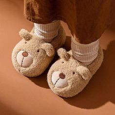 Nothing beats slipping your feet into a warm pair of slippers on a chilly winter morning. With cute cartoon bear design slippers, your girls are sure to find their new favorite creature comforts. It is crafted from soft fabric and flexible insoles; these adorable bear kid slippers prioritise comfort before all else. So get ready for bedtime with the help of some fluffy characters when you slip into these bear slippers. Upper Material: Fur Lining Material: Suede Kids Bunny Slippers, Fluffy Bunny Slippers, Kid Slippers, Elephant Slippers, Trendy Slippers, Cute Cartoon Bear, Bear Slippers, Bunny Slippers, Toddler Slippers