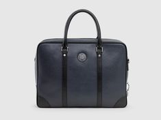 a black and grey briefcase on a gray background