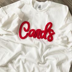 Cardinals Pullover embroidered with chenille White with Red Chenille *We use only the highest quality Heavy Blend Gildan Unisex Sweatshirts Laundering: wash inside out and line dry for best results. Team Sweatshirts, Sweatshirt Oversized, Embroidered Sweatshirt, School Mascot, Embroidered Sweatshirts, Cardinals, Unisex Sweatshirt, Inside Out, Gender Neutral