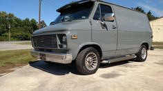 a gray van parked in a parking lot