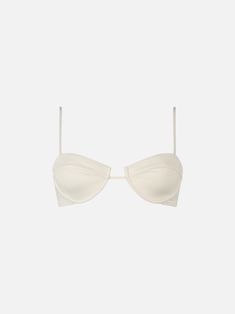 Dive into comfort and style with our Salina underwired bralette top. This elegant swimwear piece features a plain cream color, perfect for a classic yet striking beach look. Designed with adjustable shoulder straps, it ensures a personalized fit for maximum comfort and support. Composition: 90% poliammide 10% elastan Modern Swimwear With Built-in Bra For Summer, Bandeau Bra With Built-in Bra For Beach, Chic Bandeau Swimwear With Built-in Bra, Chic Solid Color Underwire Swimwear, Summer Bra With Padded Underwire Cups, Elegant Summer Bra With Removable Pads, Summer Underwire Bra With Padded Cups, Chic Underwire Swimwear With Removable Bra Pads, White Nylon Underwire Bra