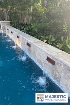 5 copper spillways mounted into a white stone wall, draining into pool Water Feature Pool, Water Spouts, Commercial Landscaping, Pool Fountain, Waterfall Features, Pool Waterfall, Small Pools