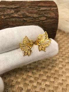 Christmas Gift, Holiday Gift,  Gold Stud earrings -  Butterfly Shape Stud Earrings - Stud Earrings for Women These gold earrings make a thoughtful gift for a specials someone or treat for yourself.  Add a touch of elegance to your outfit with these stunning flower stud earrings. Gift for yourself and to your loved ones. Material: 24k gold plated Size:  Length: 1cm Wide: 1cm Lead & Nickel free Tarnish resistant Hypoallergenic Gold Butterfly Earrings For Gift, 14k Gold Butterfly Earrings For Gift, 14k Gold Butterfly Earrings With Charm, Hypoallergenic Butterfly-shaped Yellow Gold Jewelry, Gold Butterfly-shaped Pierced Earrings, Butterfly Shape, Flower Earrings Studs, Flower Studs, Gold Studs