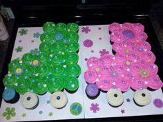 two decorated cupcakes sitting on top of a tray